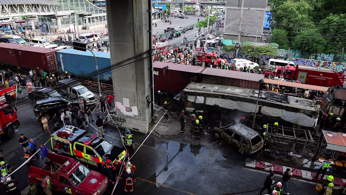 At least eight dead, 25 injured in train collision that sparks bus fire in Bangkok