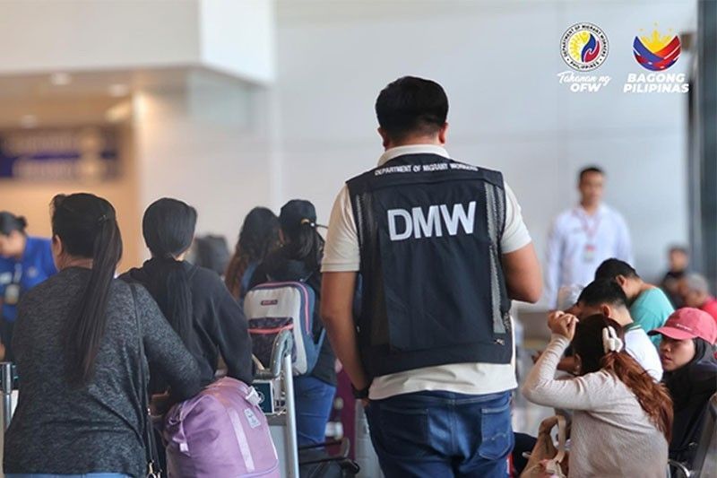 DMW Distributes P1.09M Aid to 62 Returning OFWs