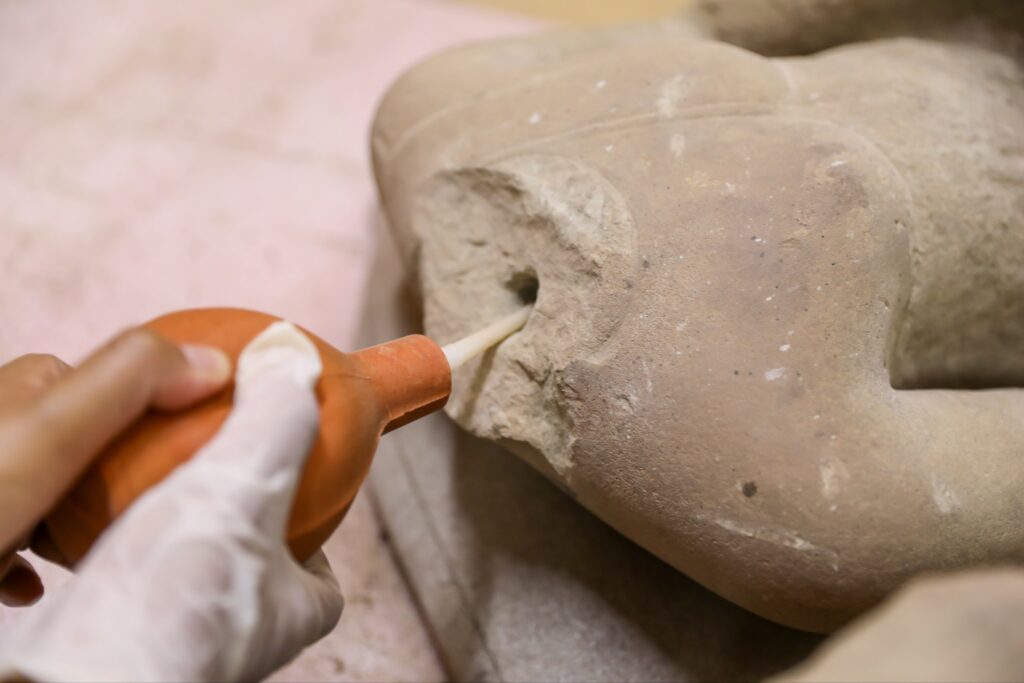 Nearly 300 Buddha Statue Fragments Found at Angkor Wat Undergoing Cleaning for Restoration