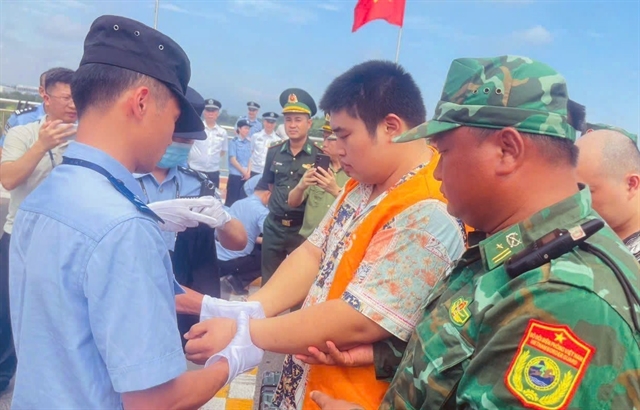 Vietnam hands over 33 Chinese nationals to China for immigration violations