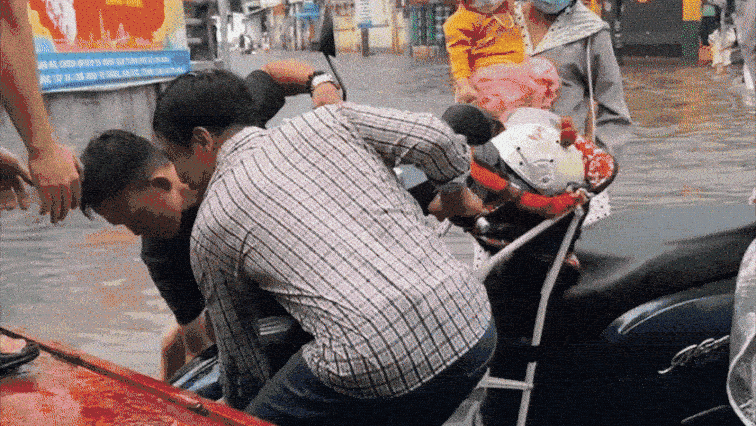 Motorized Rickshaws Navigate Flooded Streets in Ho Chi Minh City After Heavy Rain